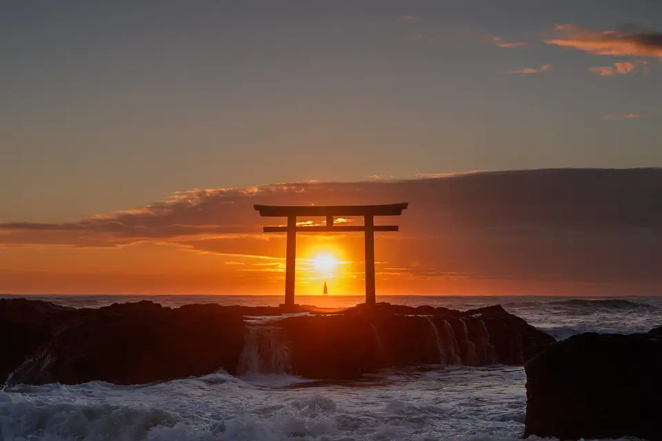 Sunrise behind the torii on the rocks at Oarai, Ibaraki